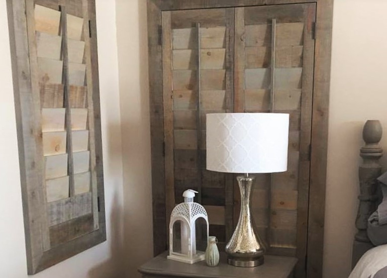 Destin bedroom with recycled wood shutters.